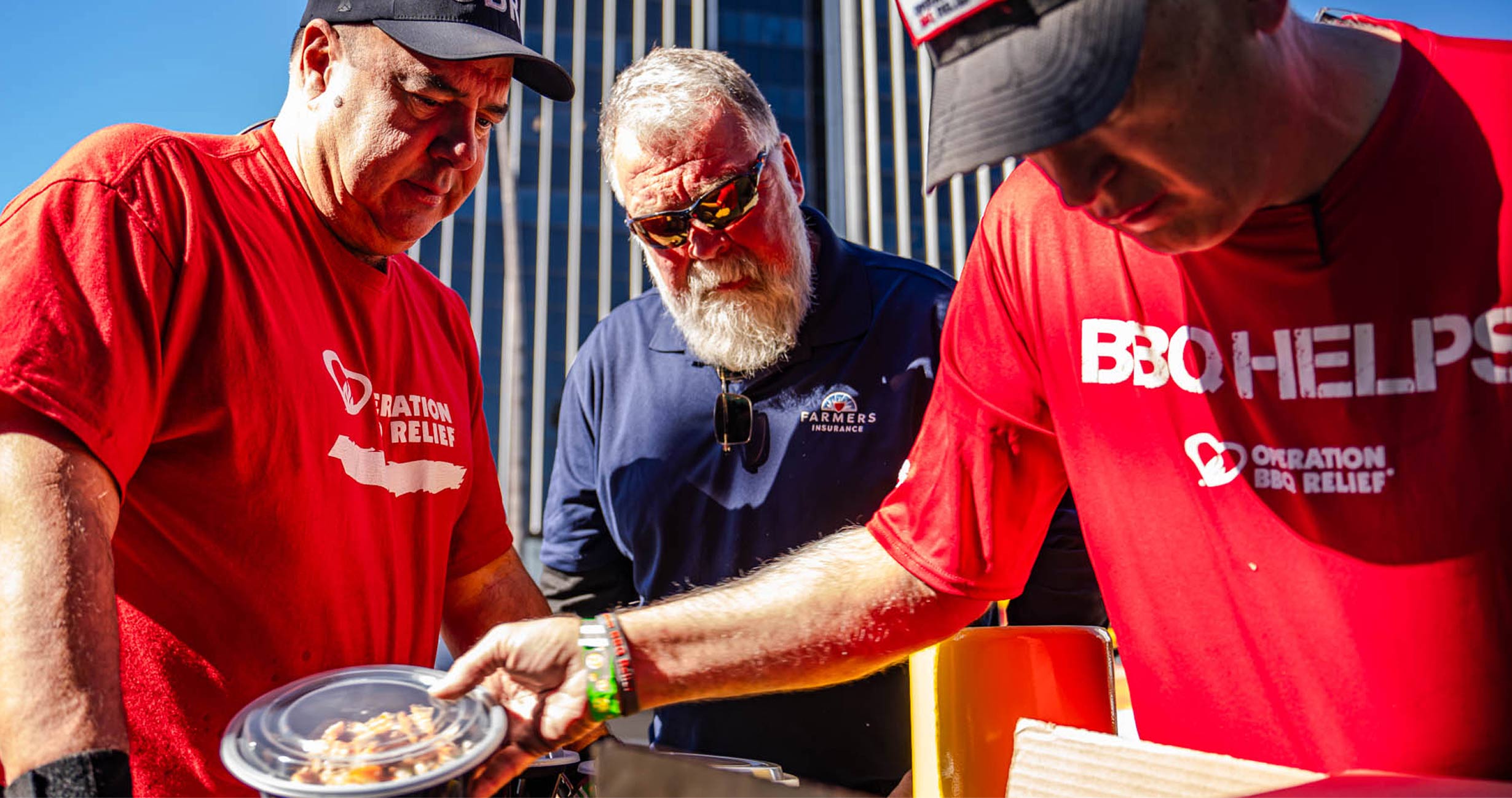 3 men working together to prep food