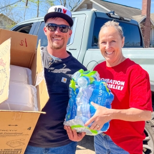Volunteers with bottled water